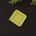 Macro detail of a light green square resin pendant with woven texture and metal ring - Square Green
