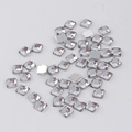 Macro view of 4mm square acrylic faceted rhinestones with silver flat back for DIY crafts - Clear White