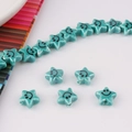 Detail of green star-shaped ceramic beads with smiley face for DIY jewelry making - Green