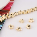 Macro detail of yellow star-shaped ceramic beads with smiley face and pearl finish - Star Smiley Face (1#) / Milk Yellow