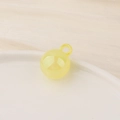 Macro shot of bright yellow translucent resin ball charm with integrated hanging loop - Large / Yellow