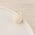 Close-up of a smooth cream white resin round bead pendant with integrated hanging loop - Small / Off White