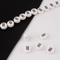 Detailed view of white ceramic Aquarius zodiac beads for DIY bracelet jewelry making - Aquarius
