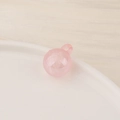 Close-up of a translucent pink candy-colored resin bead pendant for DIY jewelry making - Small / Pink