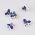 Detailed view of hand-painted butterfly ceramic beads with gold pin for DIY jewelry - Style 1