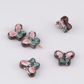Close-up of hand-painted ceramic butterfly beads for DIY jewelry making and bracelets - Size 6