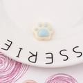 Close-up of a cute resin cat paw charm in cream and light blue for DIY phone case decoration - Light Blue Style (1#)