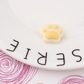 Detailed view of DIY resin cat paw charms in yellow and white for phone case decoration - Bright Yellow Style (2#)