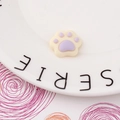 Close-up of cream and lilac resin cat paw charms for DIY phone case crafts - Light Purple Style (4#)