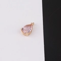 Detailed close-up of a pink pear-cut crystal pendant with a gold plated setting and bail - Size 9