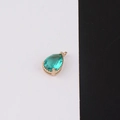 Detailed view of pear-shaped green crystal pendant with gold-plated bezel for DIY jewelry - Size 8