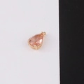 Detailed view of teardrop pink crystal pendant with gold plating on black and white background - Size 7