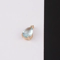 Macro detail of a pear-shaped light blue crystal pendant with a gold plated beaded setting - 3#