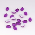 Macro detail of purple oval flatback acrylic gems with reflective silver backing - 4x6 / Purple