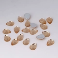 Detailed macro of teardrop champagne acrylic flatback rhinestones for DIY crafts and jewelry - 7x10mm / Champagne