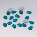 Macro detail of teal pear-shaped flatback acrylic rhinestones for DIY crafts and decor - 7x10mm / Teal