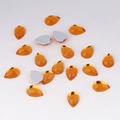 Close-up of amber teardrop acrylic rhinestones with flat silver foil backing for DIY crafts - 7x10mm / Gold Yellow