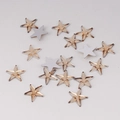 Macro shot of 10mm champagne gold star-shaped acrylic rhinestones with faceted surface - 10mm / Champagne Gold (10#)