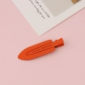 Close-up of matte orange seamless hair clip with hollow design and brand detail - Orange(14#)