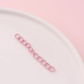 Close-up of pink painted metal extension chain with oval links for DIY jewelry making - Pink (7#)