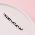 Macro shot of matte black metal extension chain links for jewelry DIY on a tray - Black (4#)