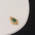 Macro view of gold teardrop pendant with green zircon and hollow vintage filigree pattern - Emerald Green (Style 7)