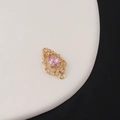 Macro detail of a pink teardrop zircon charm connector with gold-plated hollow filigree pattern - Pink(6#)