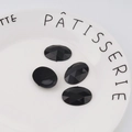 Detalle de piedras ovaladas negras facetadas con reverso plano para artesanía DIY - Especificación Estándar / Negro