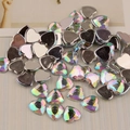 Macro view of 12mm heart shaped AB color acrylic rhinestones for DIY crafts and nail art - AB Rainbow