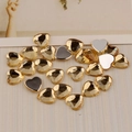 Flat back heart rhinestones in amber color with faceted surface for DIY crafts - Champagne