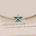 Macro view of blue star-shaped acrylic crystal with faceted surface for DIY jewelry - 20mm Star / Aqua