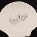 Detail view of silver angel wing charms with heart-shaped zircon for DIY jewelry making - 5# Large Winged Heart Style (Clear Rhinestone)