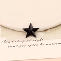 Detailed macro view of a 20mm black star acrylic flatback rhinestone with 3D faceted cut - 20mm Star / Black