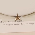 Detailed close-up of champagne star acrylic faceted flatback stone for DIY jewelry - 20mm Star / Champagne