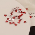 Macro detail of red acrylic 6mm star rhinestones for DIY nail art and phone cases - 6mm Pentagram / Red