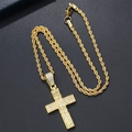 Detailed close-up of golden iced-out cross pendant with a thick rope chain necklace - Twist Chain / Gold