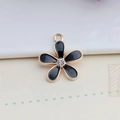 Macro detail of alloy flower charm with black enamel petals and center rhinestone - 18*20mm / Black Five-Petal Flower