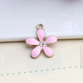 Detailed close-up of a pink enamel five-petal flower pendant with sparkling diamond center - 18*20mm / Pink Five-Petal Flower