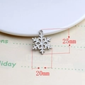 Detailed view of white enamel snowflake charm with silver edges measuring 25mm by 20mm - Snowflake Style 1 (7#)
