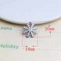Macro shot of a 20mm by 18mm silver alloy snowflake pendant for DIY jewelry projects - Snowflake Style 2 (8#)