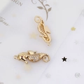 Macro view of gold-plated seahorse pendants with micro-pave zircons and ruby eyes - Seahorse Style (5#)