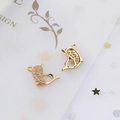 Macro detail of gold plated dolphin charms with micro paved cubic zirconia stones for DIY jewelry - Dolphin Style (4#)
