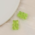 Detail of two translucent light green resin bear charms for DIY jewelry and hair accessories - Light Green
