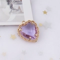 Close-up of heart-shaped purple zircon pendant with gold twisted metal border on mesh - 11#Purple