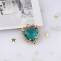 Detail of heart-shaped copper pendant with green zircon and gold textured border - 3# Dark Green