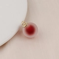 Close-up of a matte iridescent bubble bead pendant with a red core for DIY jewelry making - 16mm / Dark Red