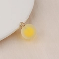 Macro shot of a yellow frosted bubble resin bead with gold loop for DIY jewelry making - 16mm / Yellow