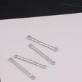 Close-up of four silver textured connector bars with double holes for DIY jewelry making - Tree Branch Texture Style / White Gold