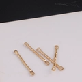 Macro shot of gold hammered metal double-hole connector bars for DIY jewelry making - Hammered Texture Style / K Gold