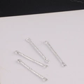 Macro shot of four silver connector bars with dual hanging holes and hammered texture - Natural Ore Texture Style / Silver
